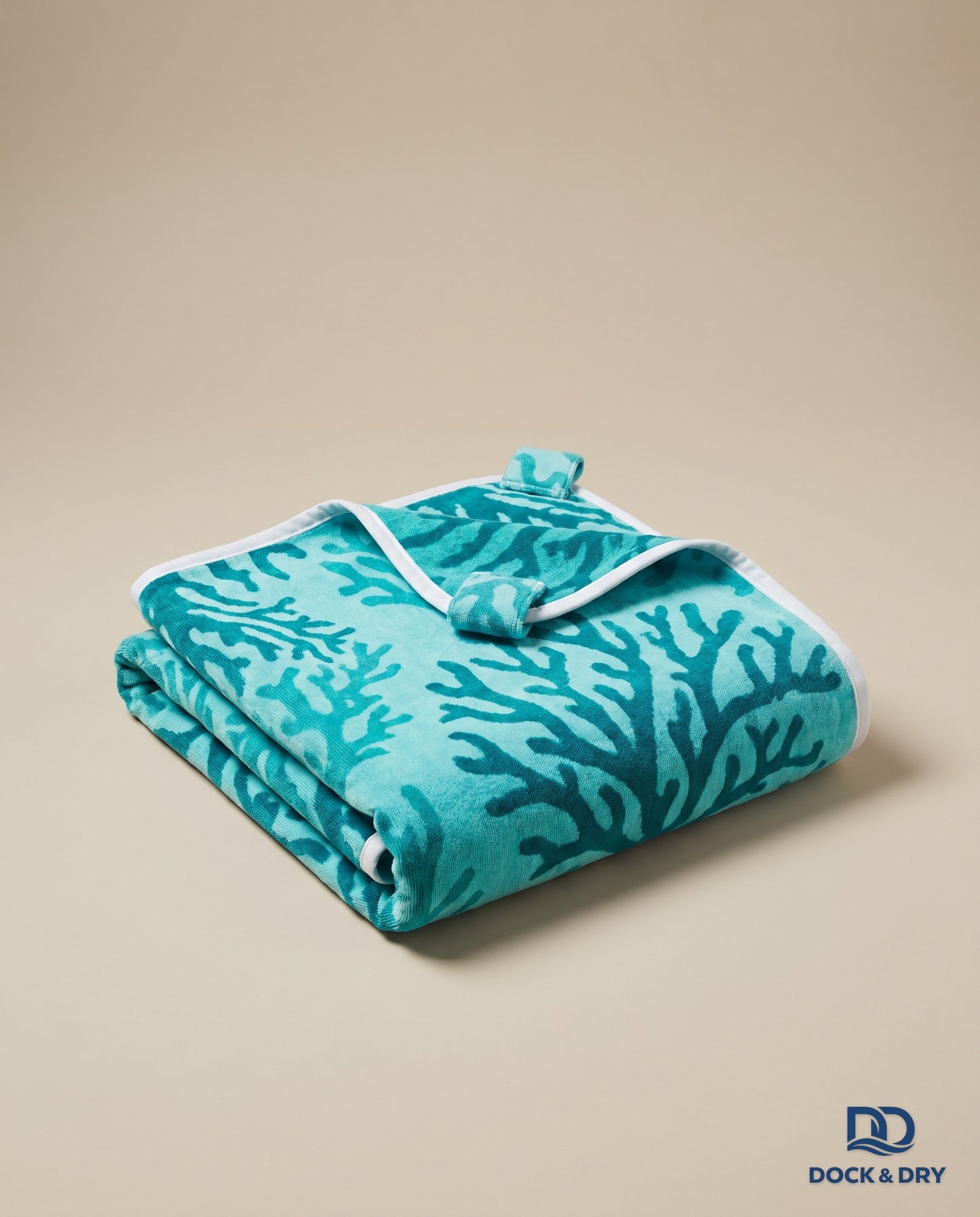 Dock & Dry magnetic beach towel – Coral Reef, folded with corner magnets