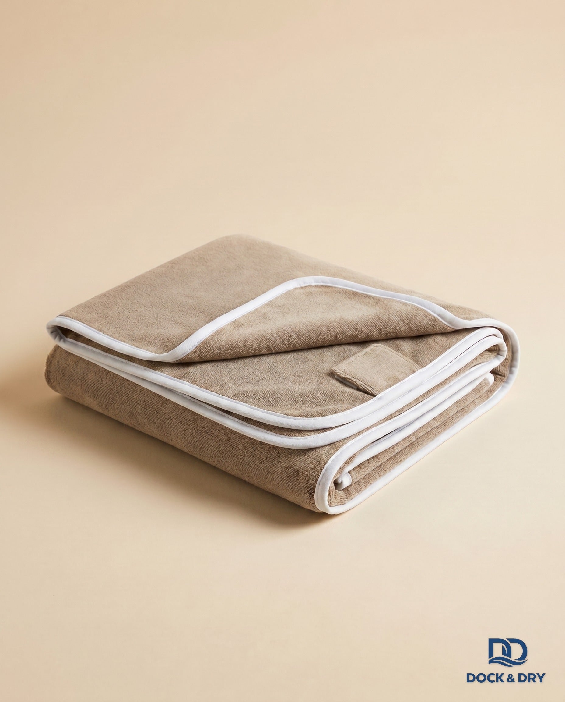 Dock & Dry magnetic beach towel – Sand Beige, folded with corner magnets