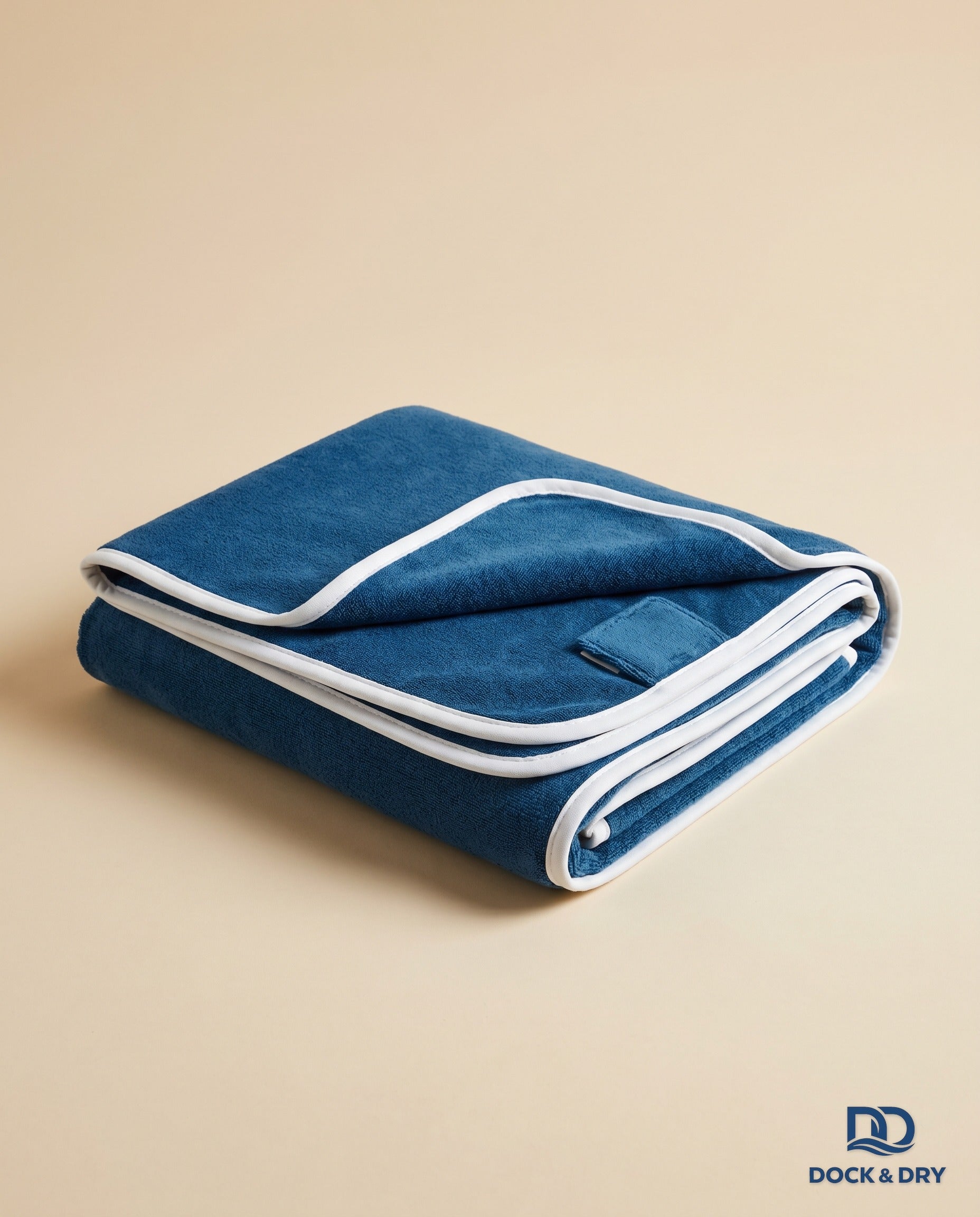 Dock & Dry magnetic beach towel – Ocean Blue, folded with corner magnets
