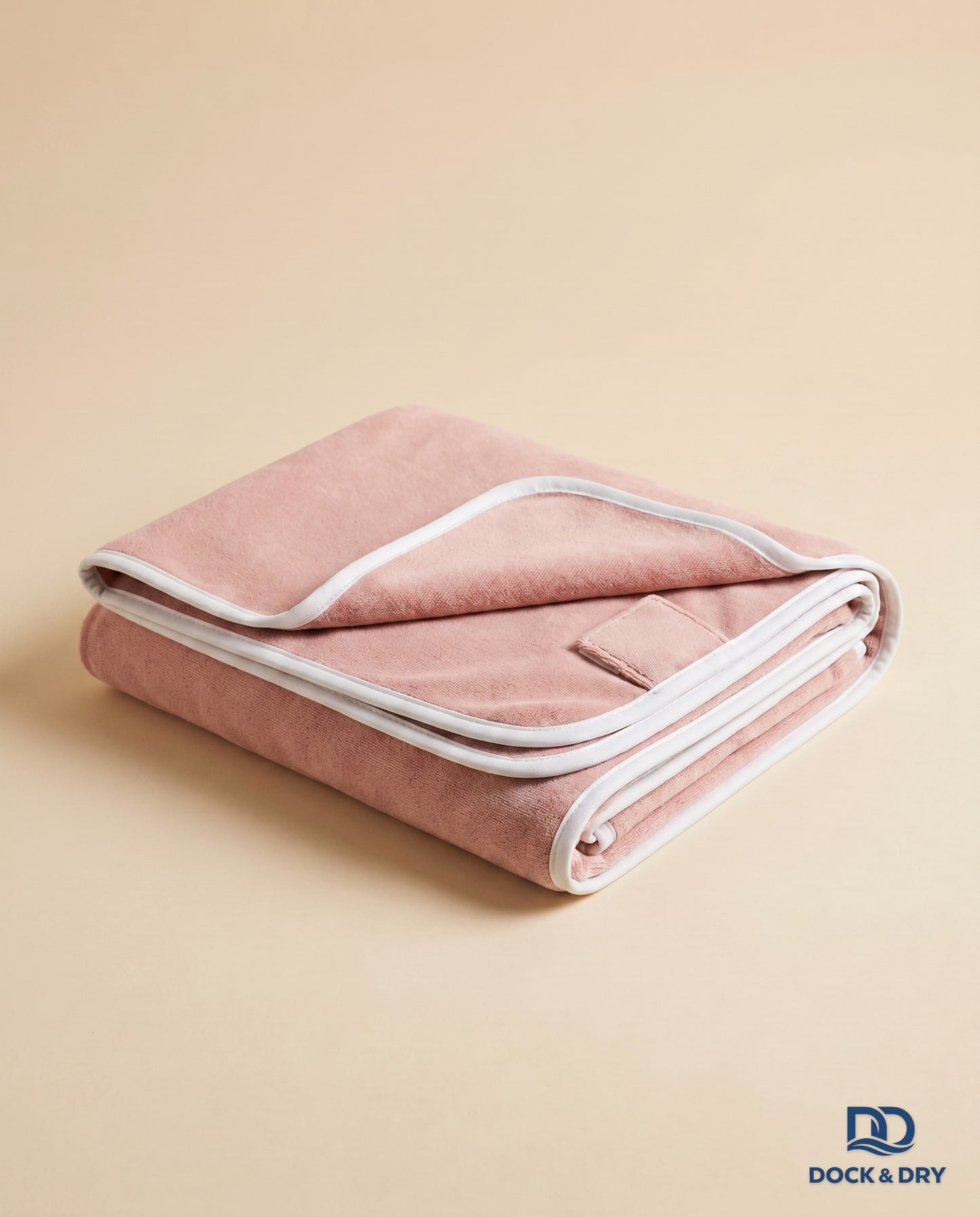 Dock & Dry magnetic beach towel – Blush Pink, folded with corner magnets