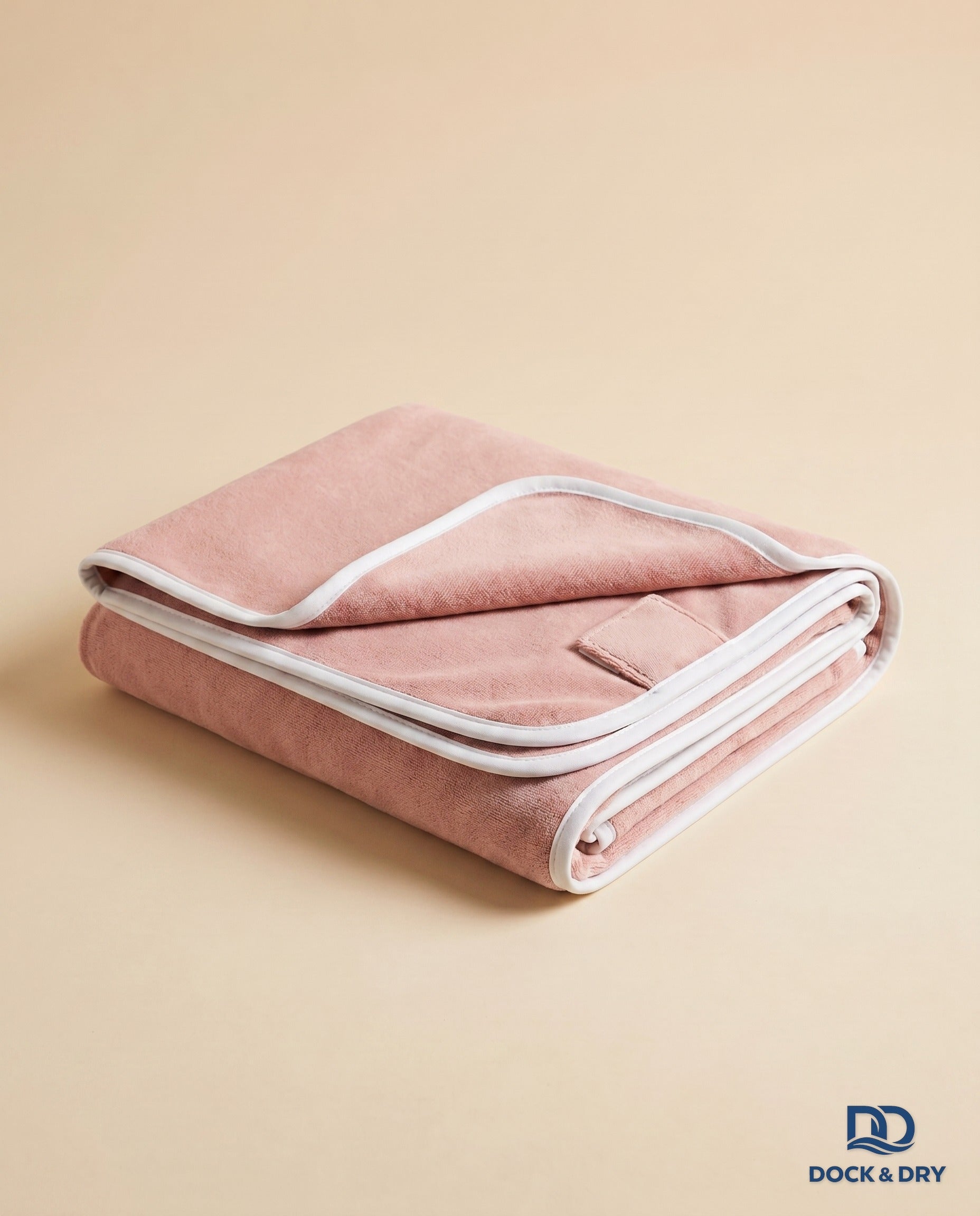 Dock & Dry magnetic beach towel – Blush Pink, folded with corner magnets