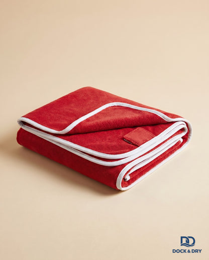 Dock & Dry magnetic beach towel – Red, folded with corner magnets