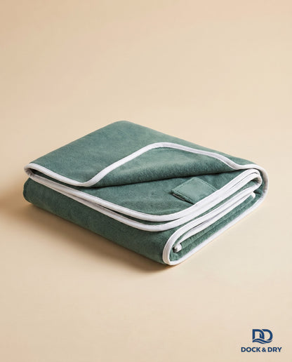 Dock & Dry magnetic beach towel – Sage Green, folded with corner magnets