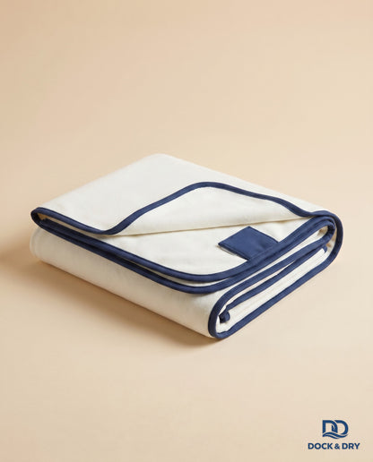Dock & Dry magnetic beach towel – White, folded with corner magnets